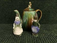 An early nineteenth century teapot, stamped 'H' to base, together with two unusual figured pots,