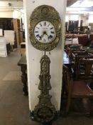 An embossed brass French wall clock by F.