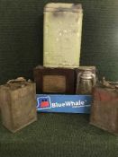 A box of vintage oil cans, tilly lamp,