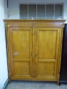 A French cherry wood double door wardrobe