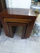 A nest of three contemporary hardwood table