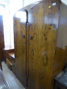 A walnut double door wardrobe together with matching dressing chest