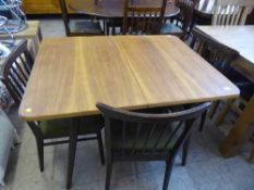 A 1950's Everest Furniture teak topped dining table and four chairs