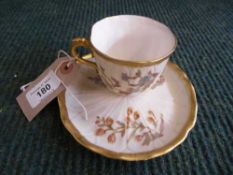 A Royal Worcester hand painted blush ivory cup and saucer