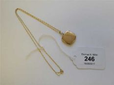 A 9ct gold locket upon 9ct gold chain