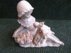 A Lladro figure - girl reclining with basket of flowers