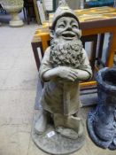 A garden figure of a gnome