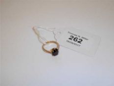A 9ct gold garnet ring