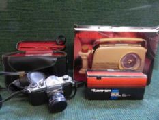 A box of Bush retro style radio, cased Pentax ASHAHI camera with lens,