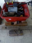 A plastic box containing vintage wood working planes, chisels, spirit levels, clamps,