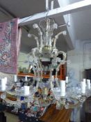 An early twentieth century decorative twelve branch glass and brass chandelier