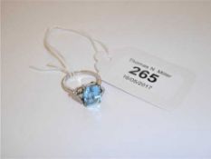 An 18ct white gold diamond and aquamarine ring