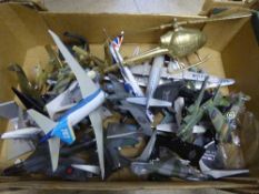 A box of model air craft together with a brass aeroplane on stand and brass helicopter