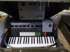A Hohner electravox accordion with amp