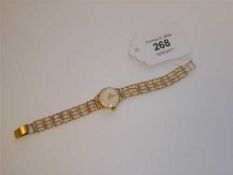A lady's 9ct gold Omega wristwatch on 9ct gold bracelet