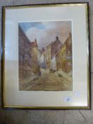 A framed watercolour of Church Street, Staithes, indistinctly signed,