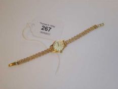 A lady's 18ct gold Omega Geneve wristwatch on 9ct gold strap