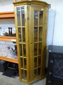A pine glazed corner display cabinet