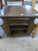 An oak magazine table fitted a drawer