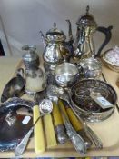 A tray of four piece plated tea service, wine cooler, napkin rings, serving spoons,