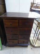 A contemporary hardwood eight drawer chest