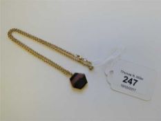 A 9ct gold mounted agate pendant on chain