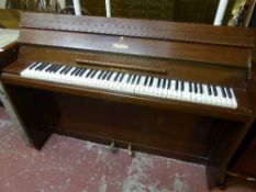 A mahogany cased mini piano by Evestaff Miniroyal
