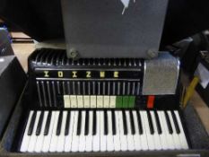 A Hohner electravox accordion with amp