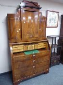 A continental mahogany cylinder bureau bookcase