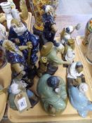 A tray of nine Chinese pottery figurines