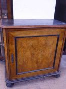 A 19th century continental burr walnut and ebonised cabinet