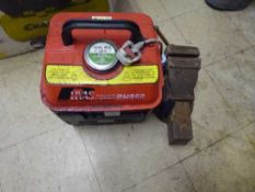 A heavy duty bench vice together with a portable generator
