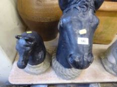 Two garden horse head ornaments