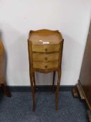 A miniature three drawer mahogany bedside chest