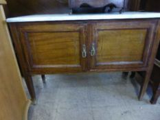 An inlaid mahogany marble topped washstand