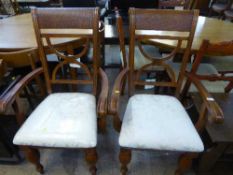 A pair of contemporary scroll arm armchairs