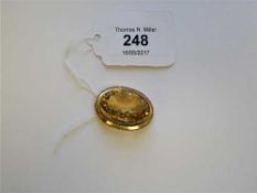 A citrine brooch in yellow metal mount