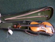 An antique violin with two bows in case