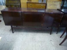 A mahogany triple door low sideboard