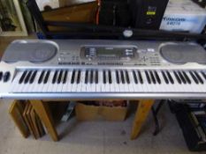 A Casio WK-3500 Smart Media electric keyboard on stand with lead