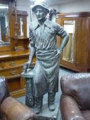 An impressive bronze statue - The Blacksmith with hammer, standing on plinth base, height 190 cm.