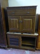 An oak effect double door cabinet together with an oak effect audio stand