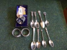 A collection of eight silver and continental silver teaspoons,