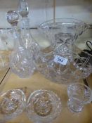 A tray of two lead crystal decanters with stoppers, crystal basket, candle holders,