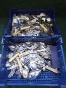 Two baskets of plated and stainless steel cutlery