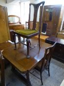 An early 20th century pull out table and three chairs