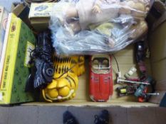 A box of two mid twentieth century dolls, Garfield and Batmobile phone, Triang control unit,