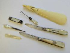 Two silver and mother of pearl mounted fruit knives, a carved shoe horn,