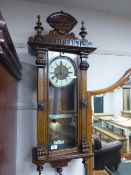 A Victorian inlaid mahogany Vienna wall clock