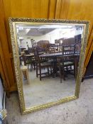 A large gilt framed over mantel mirror